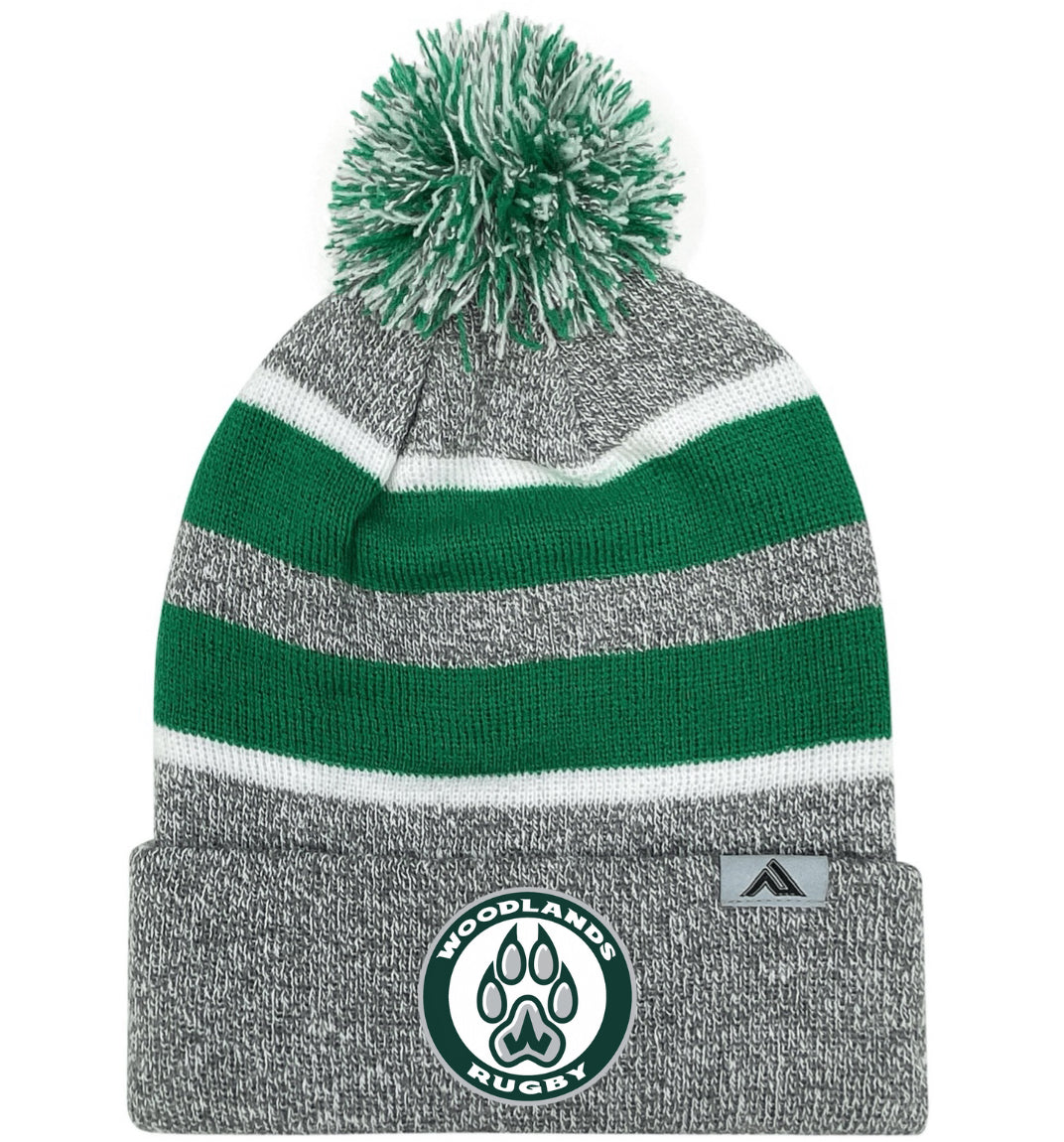 The EMB Augusta Woodlands Youth Paw Print Hooped Beanie features green and white stripes with a paw print logo on the front cuff—stylish gray fan gear perfect for young supporters to display their team spirit.
