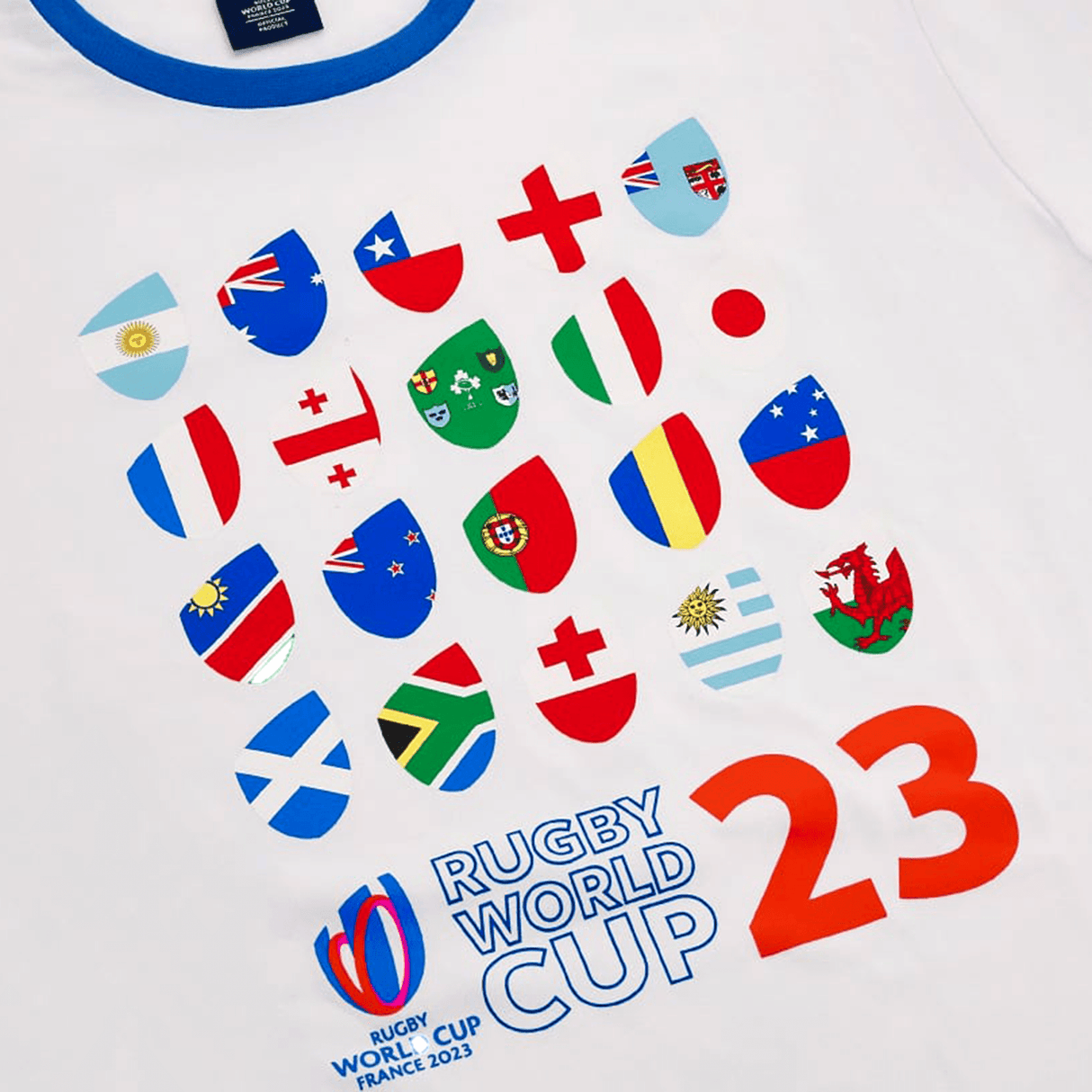 A white RWC23 20 Nations Poly/Cotton Tee by Macron featuring the Rugby World Cup logo and the RWC23 emblem.