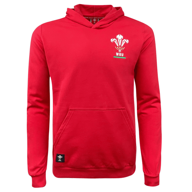 The Wales Rugby Union Pullover Fleece Hoodie by Macron is a red hoodie with an embroidered WRU logo featuring a feather design on the chest. Perfect for Welsh Rugby fans, this Macron hoodie has a front pocket and a black tag near the hem.