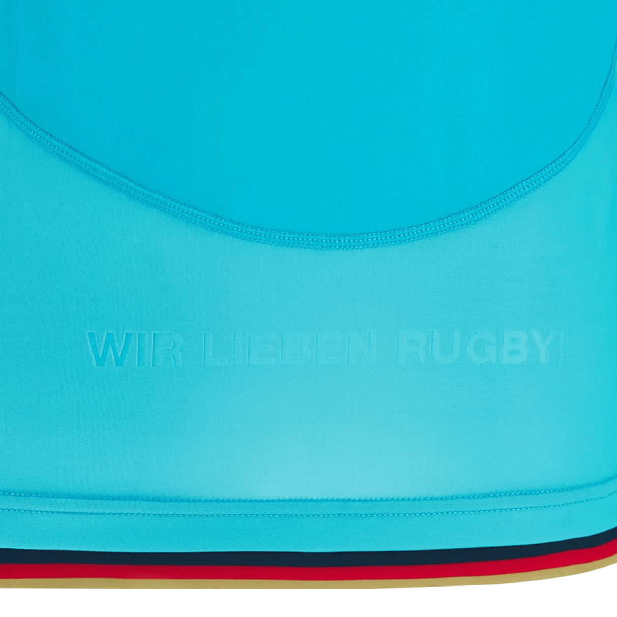 Close-up of the Deutschland Rugby 7s Away Jersey by Macron with "WIR LIEBEN RUGBY" text embossed on it. The hem features a thin black, red, and yellow stripe, embodying the spirit of the Deutscher Rugby Verband 2022/23 season.