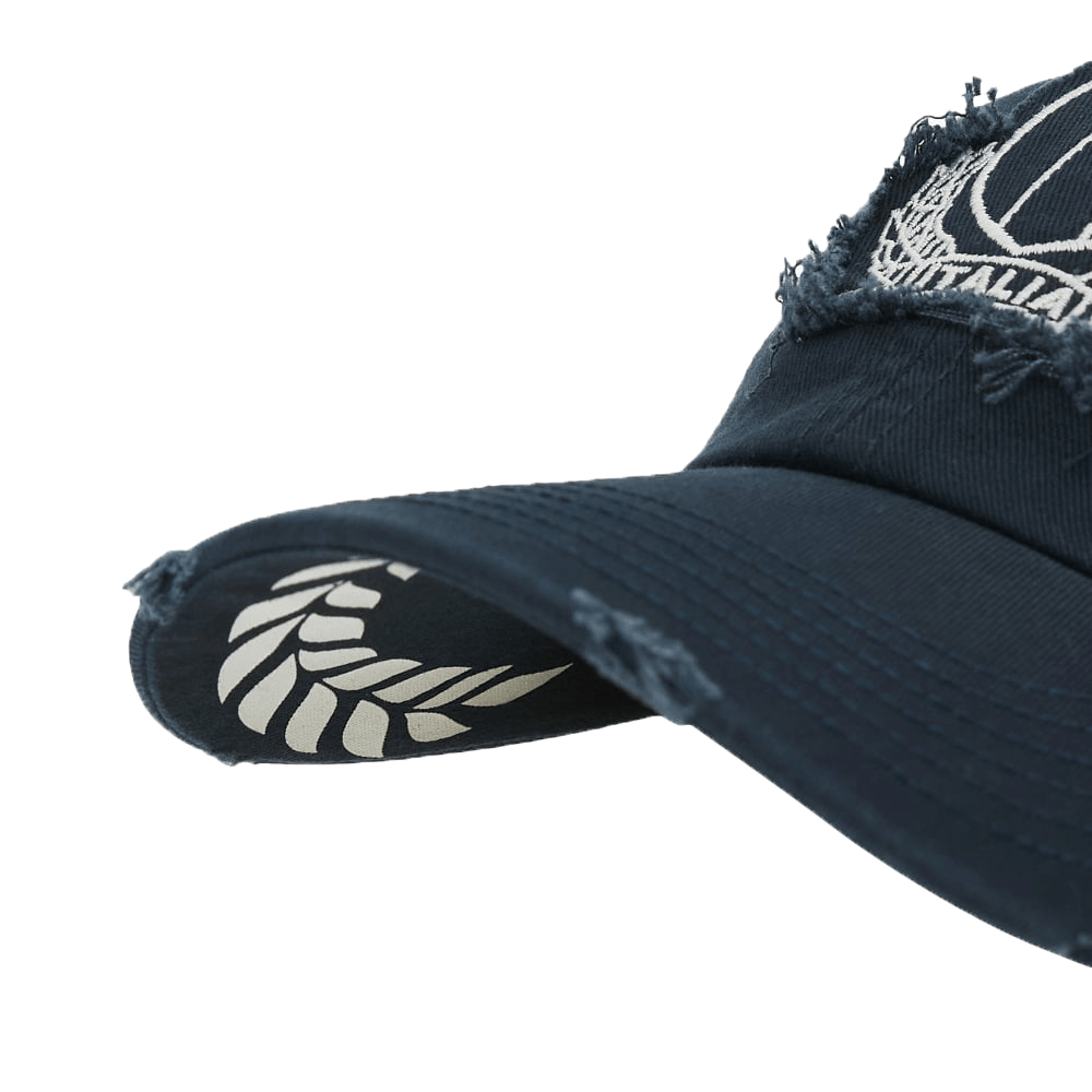 A Macron navy Italy FIR Cap 23/24 with a distressed logo on it.