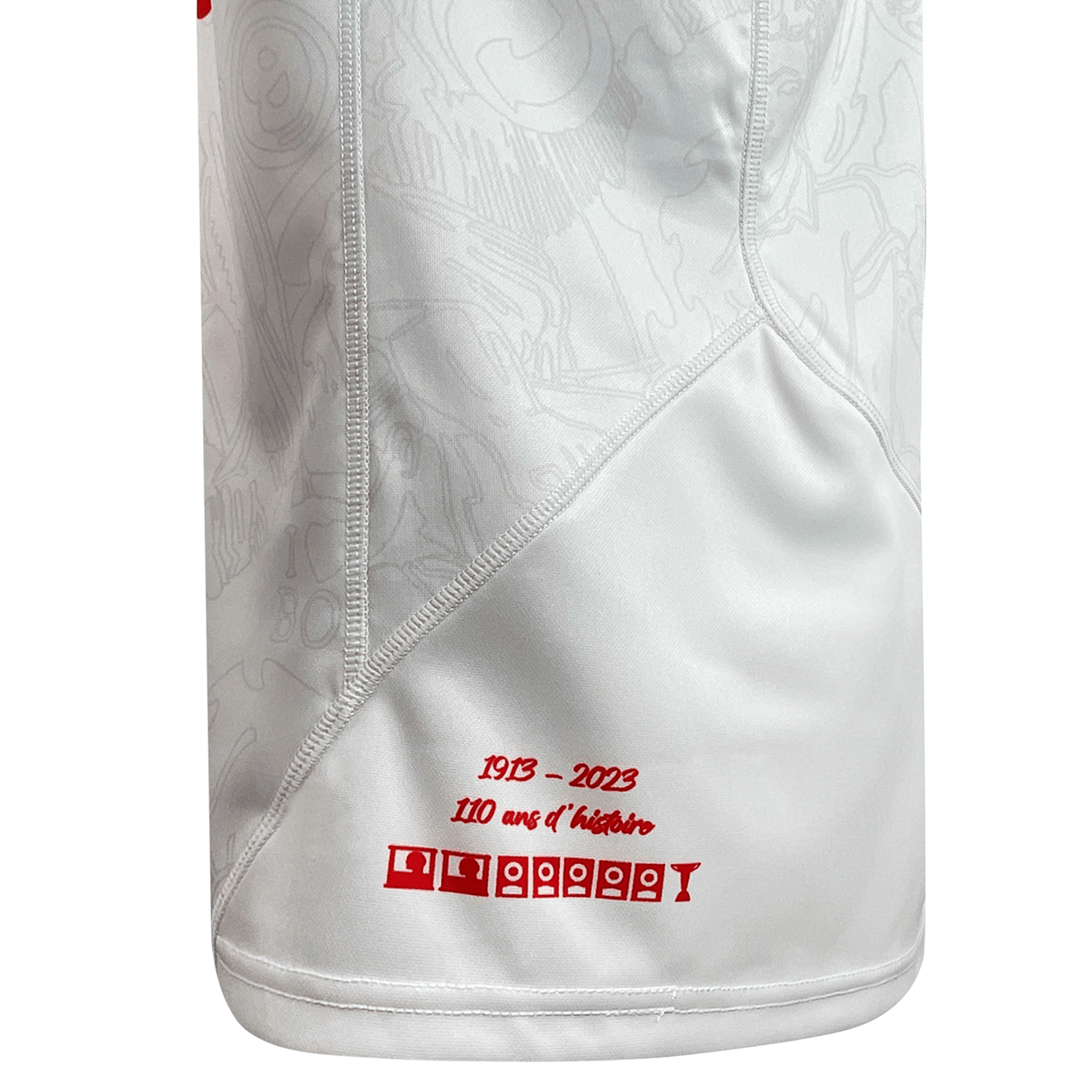 A white and red Macron Biarritz Olympique Pays Basque 23/24 Home Jersey with a Macron logo on it.