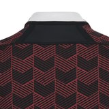 The back of a Macron Wales Rugby Union 23/24 Training Jersey with a chevron pattern.
