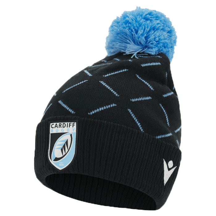 A black Cardiff Blues Pom Pom Beanie 23/24 with a blue pom-pom and a pattern of light blue diagonal lines, featuring the Macron logo on the front.
