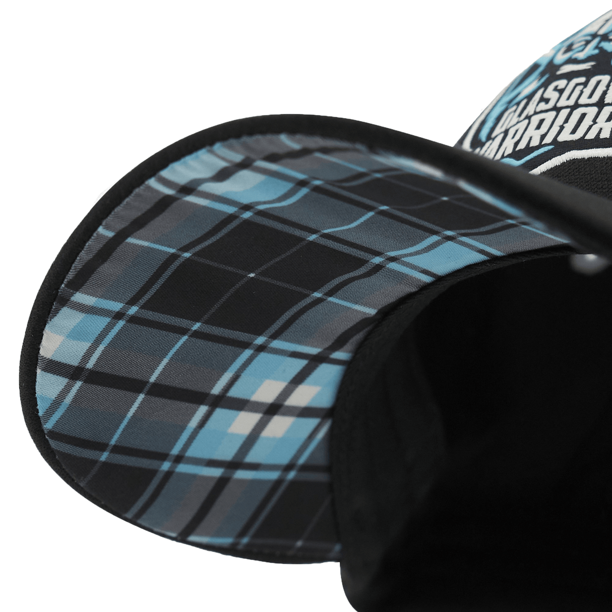 Close-up of a Glasgow Warriors Cap 23/24 by Macron with a black sole and an adjustable metal buckle.