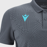 The Barbarians Poly Polo 23/24 by Macron is crafted from high-tech fabric and adorned with geometric patterns. It features a light blue Macron logo on the left chest and a tag on the inner collar that reads "macron" and "made in Albania.