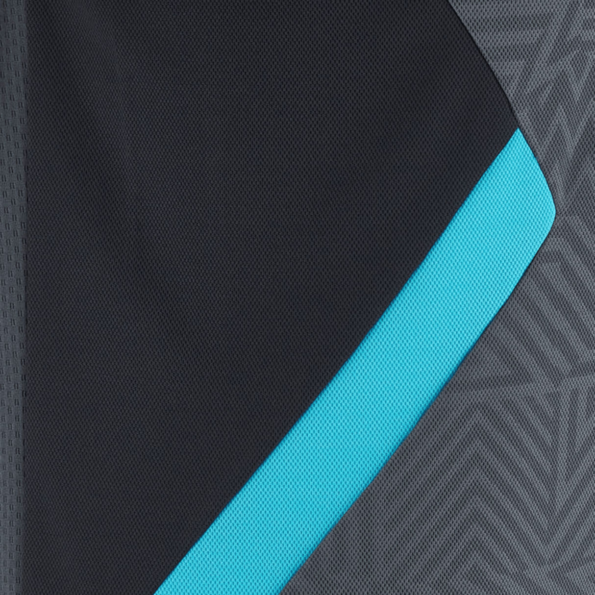 Close-up of the Barbarians Poly Polo 23/24 by Macron, featuring a black design with a blue edge, overlaid on a textured gray background with a geometric pattern.