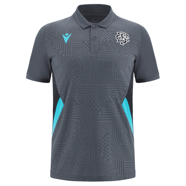 The Barbarians Poly Polo 23/24 by Macron is a gray short-sleeved shirt featuring geometric patterns and teal accents on the sides, with two logos on the front. This lightweight polo is crafted from high-tech fabric by Macron, providing ultimate comfort and performance.