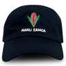 A black Samoa Cap 23/24 by Macron featuring a 6-panel cotton construction with an embroidered flower design and the text "MANU SAMOA" on the front.