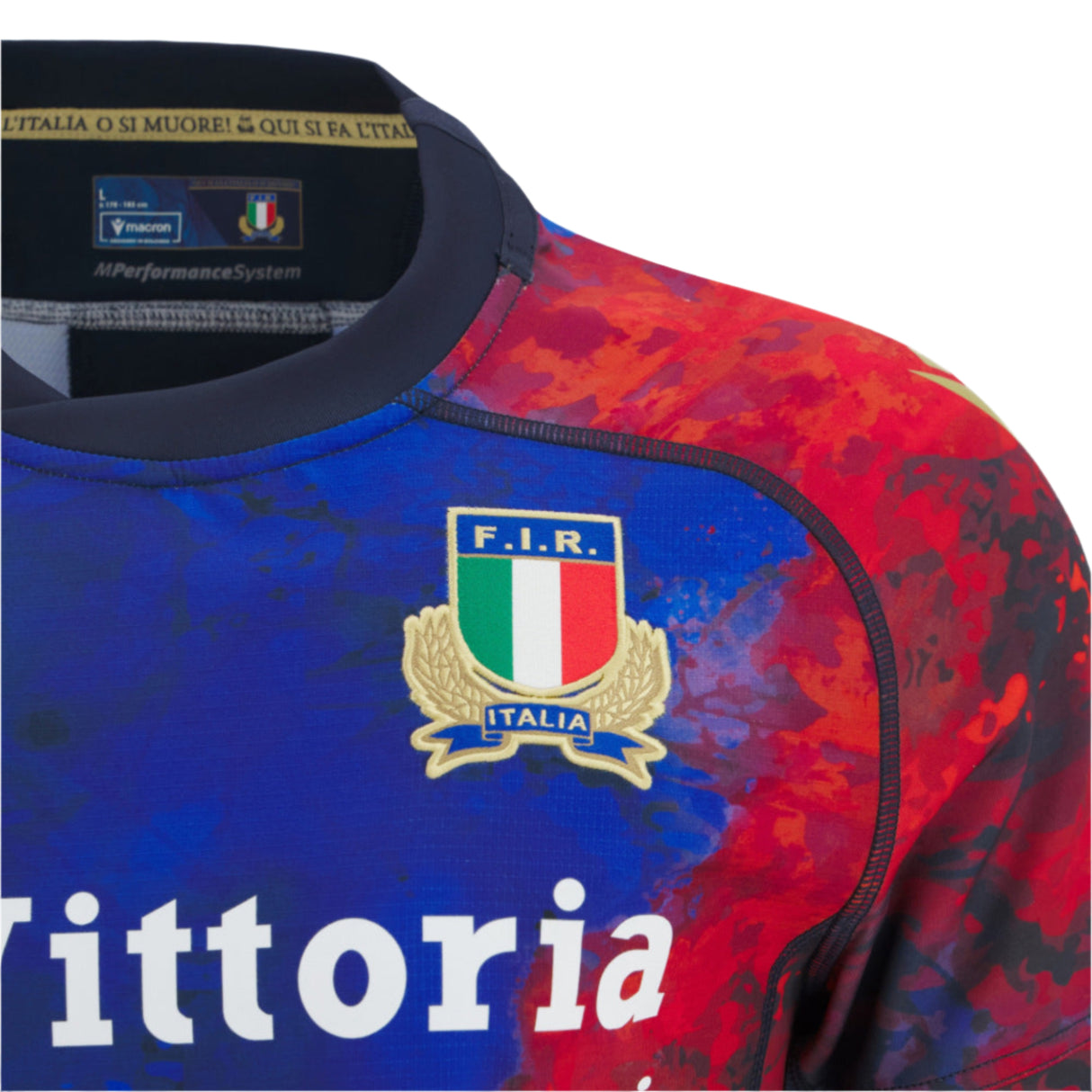 Close-up of the Italy 25/26 Replica Training Jersey by Macron, showcasing the F.I.R. Italia crest, sponsor logos, and a vibrant red and blue design.