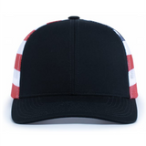 The Augusta Sportswear Printed Flag Trucker Cap features a black front, red and white checkered mesh sides, and a curved brim.