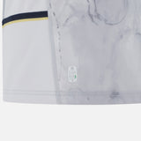 Close-up of the lower edge of the Italy 25/26 Replica Away Jersey by Macron, highlighting a seam, yellow and navy stripes, and an "Eco" label near the hem.