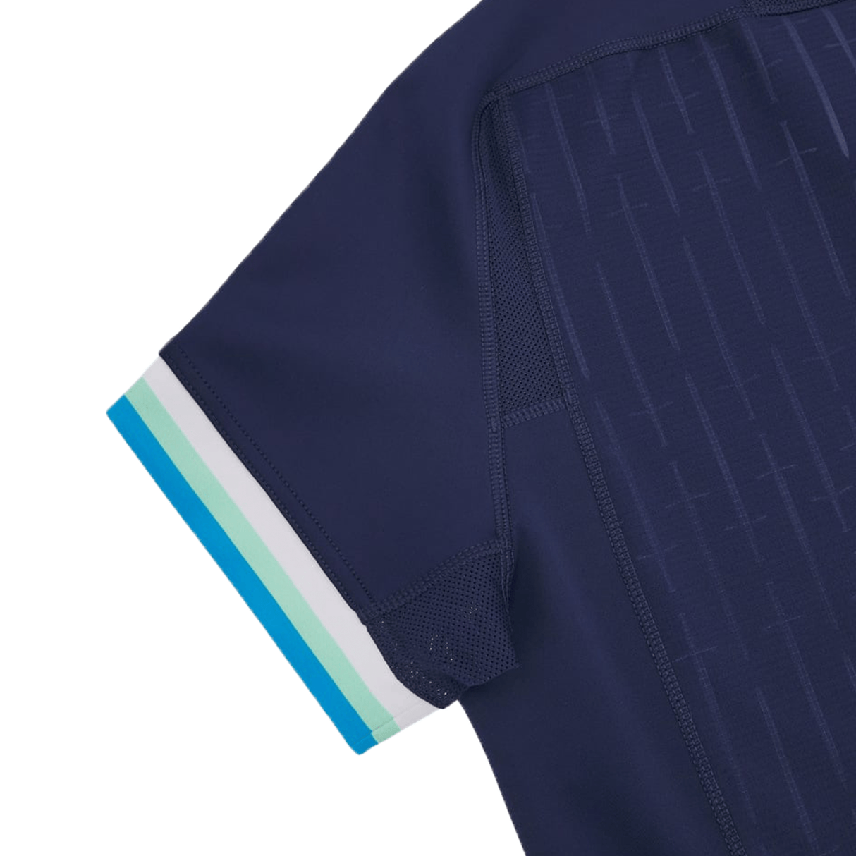 Close-up of the sleeve of a dark blue athletic shirt with a patterned texture and a white, turquoise, and teal trimmed cuff, reminiscent of the Scotland Authentic Home Jersey 24/25 by Macron.