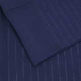 Close-up of the Scotland Authentic Home Jersey 24/25 by Macron in blue, showcasing intricate stitched detailing and a subtle sword pattern.