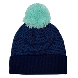 A Scotland Pom Pom Beanie 24/25 by Macron in navy blue, featuring a light blue pom-pom on top and a snowflake pattern design.