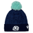 Introducing the Scotland Pom Pom Beanie 24/25 by Macron, a navy blue knit beanie adorned with a light blue pom-pom on top. It showcases an embroidered stylized thistle logo on the front and a white Macron brand emblem on the side, celebrating Scotland Rugby Union.