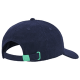 The Scotland Dad Cap 24/25 by Macron, seen from the back, showcases a dark blue corduroy design with an adjustable strap that includes a green buckle.