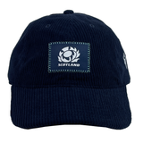 The Scotland Dad Cap 24/25 by Macron is a navy blue cap featuring a prominent crest patch on the front.