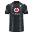 The Wales 24/25 Training Jersey by Macron, in black, features a subtle design alongside the Vodafone logo and the Wales Rugby emblem, capturing the essence of a true Wales Training Jersey.