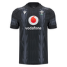The Wales 24/25 Training Jersey by Macron, in black, features a subtle design alongside the Vodafone logo and the Wales Rugby emblem, capturing the essence of a true Wales Training Jersey.