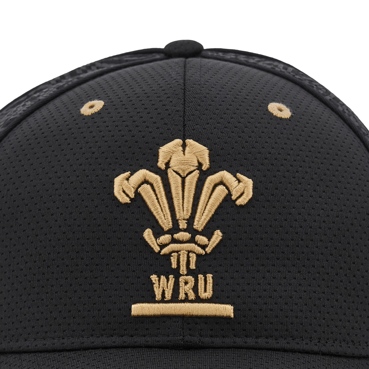 New Arrival: The Wales 24/25 Baseball Cap by Macron displays the legendary gold emblem of the Welsh Rugby Union, showcasing three feathers and the text "WRU.
