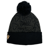 The Wales 24/25 Black Pom Pom Beanie by Macron showcases a subtle pattern and features a small WRU logo on the folded brim, making it an ideal accessory for expressing your passion for Welsh rugby.