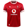 This bold red Wales 24/25 6 Nations Replica Home Jersey by Macron, made from EcoFightex fabric, showcases white accents, the Vodafone logo, and the Welsh Rugby Union emblem on the chest. As an integral piece of the Wales Rugby collection, this jersey embodies both exceptional performance and national pride.