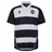The Barbarians 24/25 Home Jersey by Macron features bold black and white stripes, short sleeves, a collar, and a logo on the left chest. Resembling a classic Barbarians home jersey, this timeless piece offers an iconic look with its striking hoops.