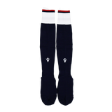 The USA Rugby 24/25 Player Home Socks by Macron are long, navy rugby socks with white cuffs, small red accents, and a geometric logo on the shin.