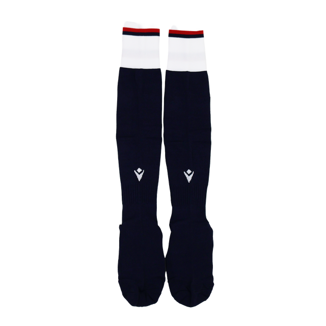The USA Rugby 24/25 Player Home Socks by Macron are long, navy rugby socks with white cuffs, small red accents, and a geometric logo on the shin.