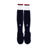 The USA Rugby 24/25 Player Home Socks by Macron are long, navy rugby socks with white cuffs, small red accents, and a geometric logo on the shin.