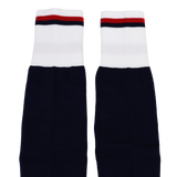 The USA Rugby 24/25 Replica Home Socks by Macron are navy blue with white cuffs featuring red and black stripes at the top, shown laid flat side by side on a white background.