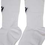 Close-up of two white USA Rugby 24/25 Player Away Socks by Macron, featuring a ribbed texture and small black design near the top—perfect for rugby players.