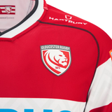 Close-up of the Gloucester 25/26 Replica Home Jersey by Macron, featuring the iconic lion crest and sponsor logos—a must-have for dedicated fans.