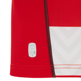 Close-up of the Gloucester 25/26 Replica Home Jersey by Macron, featuring a red and white zigzag design, visible stitching, and a subtle Eco label near the hem.