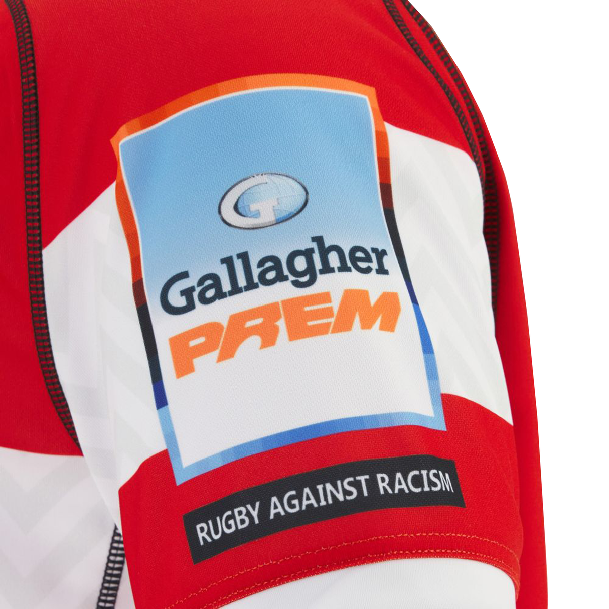 Close-up of the Gloucester 25/26 Replica Home Jersey by Macron, showing the sleeve with the Gallagher Premiership logo and a "Rugby Against Racism" patch.