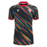 The Gloucester 25/26 Replica Training Jersey by Macron is a black sports jersey with multicolored diagonal patterns and a red and white crest on the left chest.