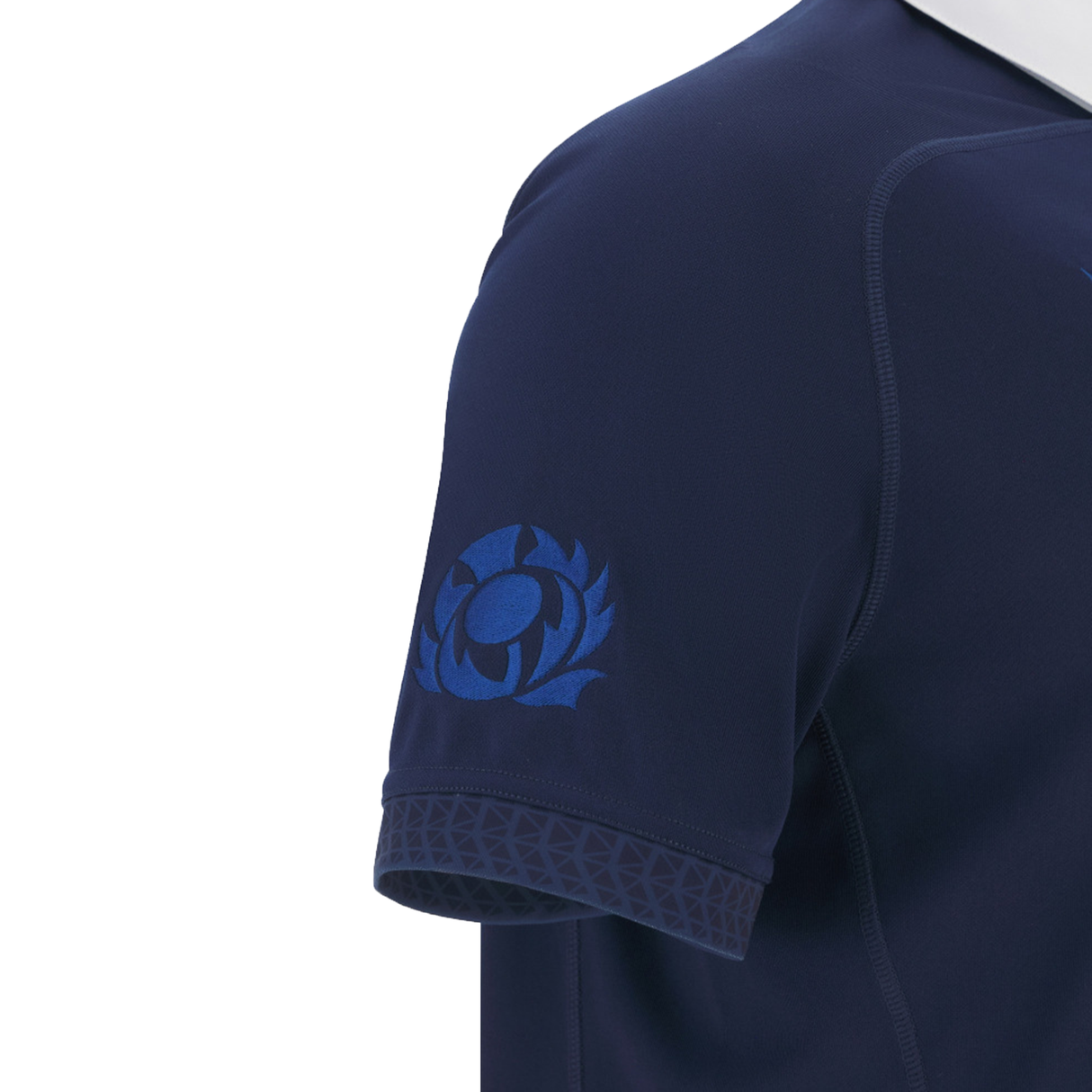 A close-up of the Scotland Rugby Union 1925 100th Anniversary Replica Home Jersey sleeve by Macron, featuring a blue thistle emblem and geometric trim, honoring Murrayfield Stadium’s centenary.