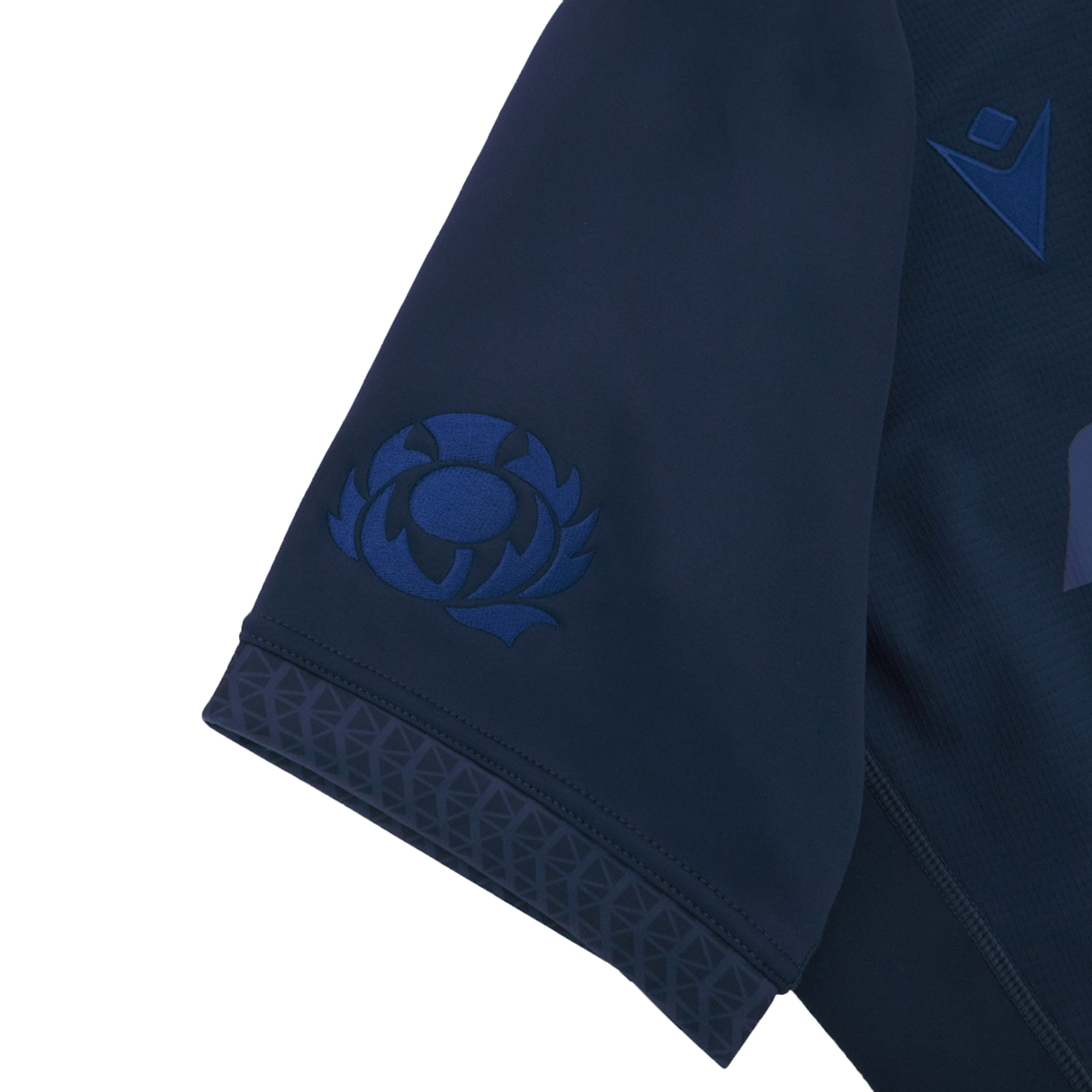 Close-up of the Scotland Rugby Union 1925 100th Anniversary Authentic Home Jersey by Macron, showing a navy sleeve with embroidered thistle emblem and geometric cuff trim, celebrating the centenary.