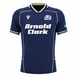 Introducing the Scotland SRU 26/27 Authentic Matchday Home Jersey by Macron—a navy blue jersey featuring the iconic white "Arnold Clark" sponsor, thistle crest, Macron logo, and Scottish flag on the sleeve. This authentic matchday shirt is perfect for fans seeking official team apparel.