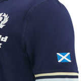 Close-up of the Scotland SRU 26/27 Cotton Replica Home Jersey by Macron in navy blue cotton, highlighting a small Scottish flag patch on the sleeve and part of a white chest logo. This Macron jersey embodies authentic team spirit in every detail.