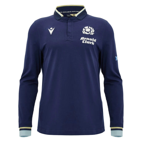 Introducing the Scotland SRU 26/27 Cotton Replica Long Sleeve Home Jersey by Macron: this navy jersey showcases the official Scotland logo, “Arnold Clark” sponsor detailing, and a small Scottish flag on the left sleeve. Crafted from comfortable cotton as a replica jersey, it’s enhanced with white and light blue trim on the collar and cuffs—ideal for fans who love the classic style of Scotland rugby jerseys.