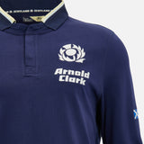 Show your support in comfort and style with the Scotland SRU 26/27 Cotton Replica Long Sleeve Home Jersey by Macron. This authentic navy blue home jersey features a thistle logo, "Arnold Clark" sponsor text, and a small Scottish flag on the right sleeve. Crafted from cotton for a classic look and feel, it’s the perfect long sleeve jersey for any Scotland rugby fan.