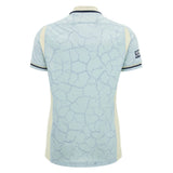 Light blue short-sleeve Scotland SRU 26/27 Replica Training Jersey by Macron featuring a cracked pattern, navy collar trim, and side panels, shown from the back. Inspired by the official Scotland Rugby Jersey design for a stylish, high-performance look.
