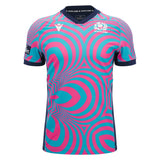 The Scotland SRU 26/27 Replica Training Jersey by Macron features blue and pink concentric circle patterns, a navy collar and sleeve trim, and prominently displays the Scotland Rugby logo on the chest. Crafted by Macron, it’s perfect for fans looking for an authentic Scotland Rugby Jersey look.