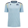 The Scotland SRU 26/27 Player Training Shirt by Macron is a light blue rugby training top with navy and yellow accents, featuring both the Scotland Rugby logo and the Macron brand logo on the chest, shown against a plain background.