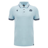 Introducing the Scotland SRU 26/27 Travel Polo by Macron—a light blue short-sleeve polo featuring a collar, button placket, dark trim on the sleeves, and two embroidered logos on the chest.