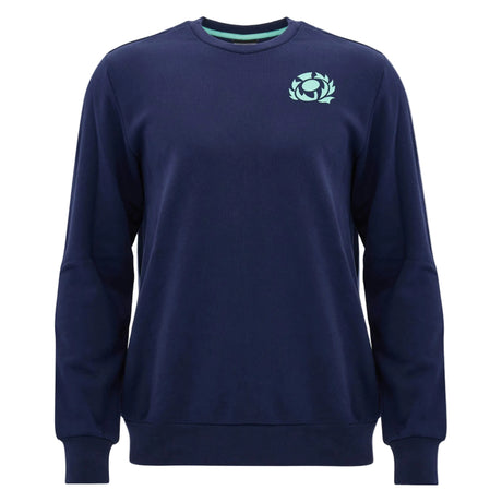 The Scotland SRU 26/27 Leisure Sweatshirt by Macron features a navy blue crewneck design with a light blue emblem on the left chest, inspired by the Scotland Rugby sweatshirt collection, and is presented against a plain white background.