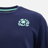 The Scotland SRU 26/27 Leisure Sweatshirt by Macron is a navy blue shirt featuring a light blue stylized thistle emblem on the upper left chest, inspired by classic Scotland Rugby sweatshirt designs.