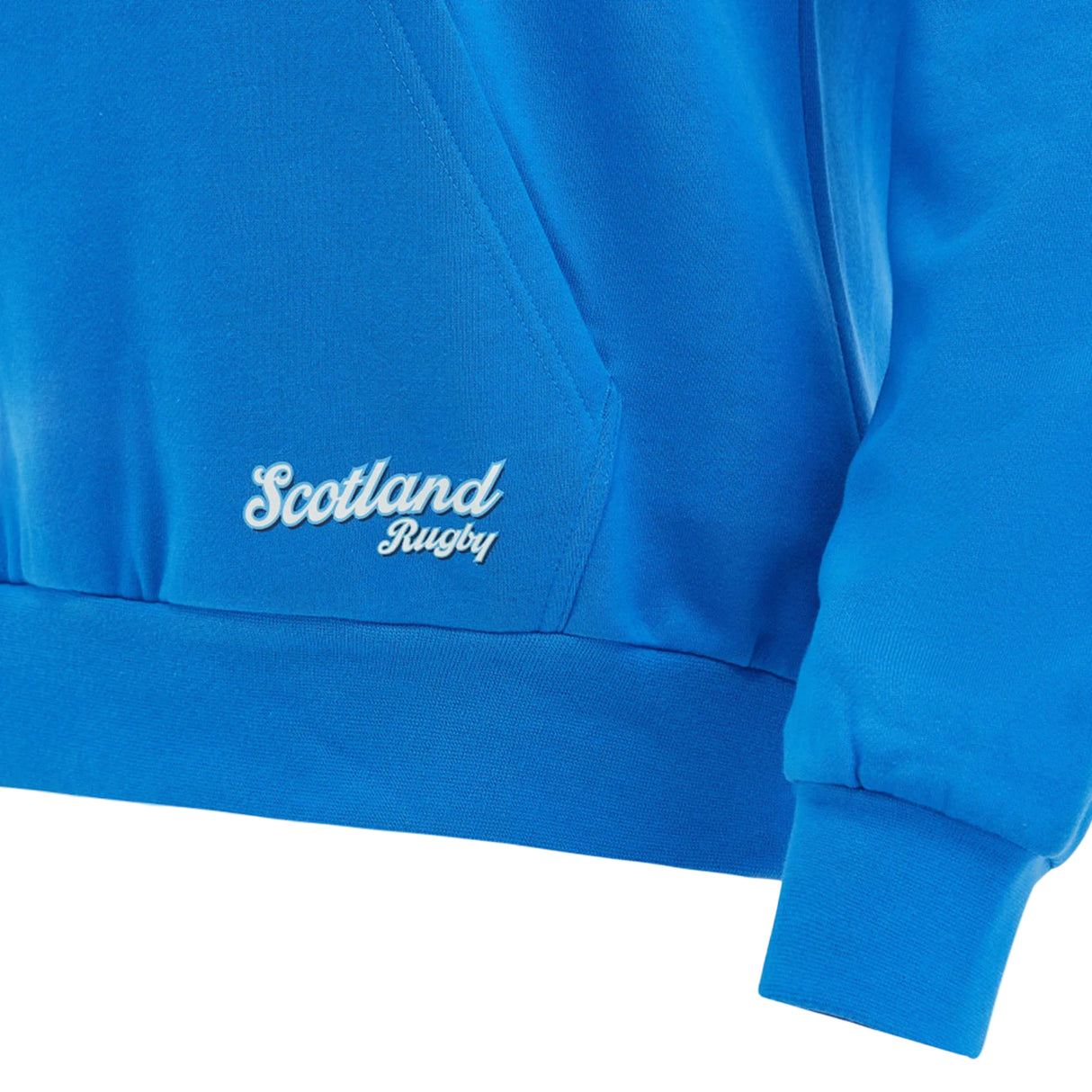 Close-up of the Scotland SRU 26/27 Leisure Hoodie by Macron in blue, featuring a kangaroo pocket and the embroidered "Scotland Rugby" text in white on the front.